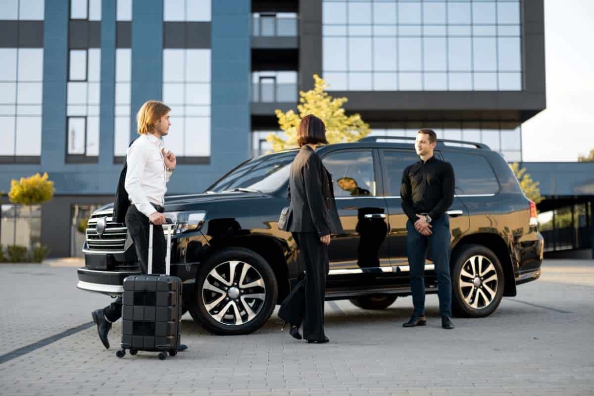 Black SUV airport transfer with chauffeur and luggage service